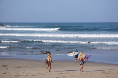 surfers on the beach ecuador